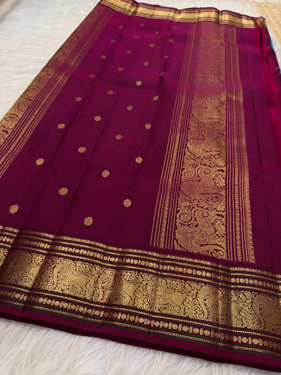 Kadal Neelam Teal-Blue Handwoven Pure Silk Kanchipuram Butta Saree with Arakku Gold Zari Border