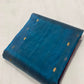 Teal Blue Tissue Silk Chanderi saree showing the broad Raspberry Pink contrast border with gold accents.