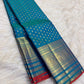 Sapphire Blue and antique-gold Kanchi Pattu saree with fine Red selvedge detail.