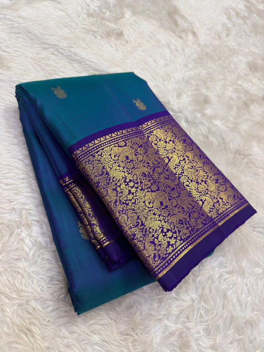 Teal blue shot colour Kanjeevaram silk saree with purple korvai vanasringaram border — Idam Living