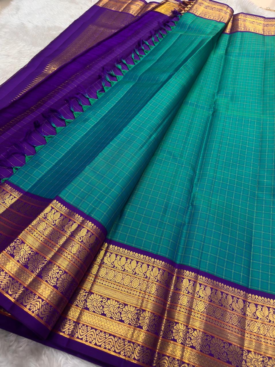 Pure silk Kanchivaram Korvai saree with antique gold zari weaving and oosi kattam grid detailing