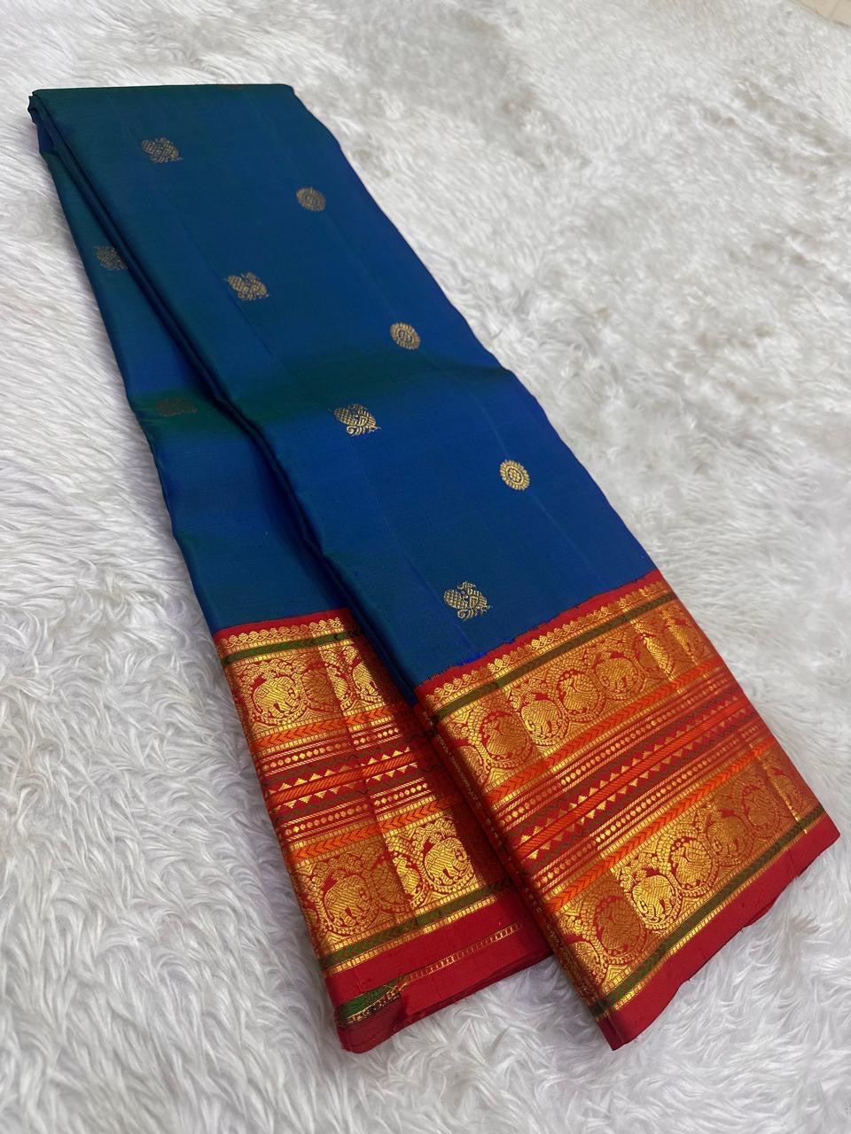 Peacock blue Korvai pure silk KanchiPattu saree with red border and Mayil Chakram buttas — full overview, Idam Living