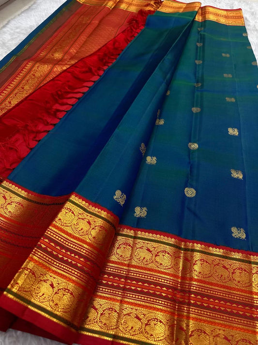 Red Korvai border with Sorgavaasal arch and Yaanai elephant motifs in antique gold zari