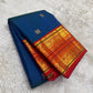 Red pallu with full Sorgavaasal and Yaanai zari procession cascading across width
