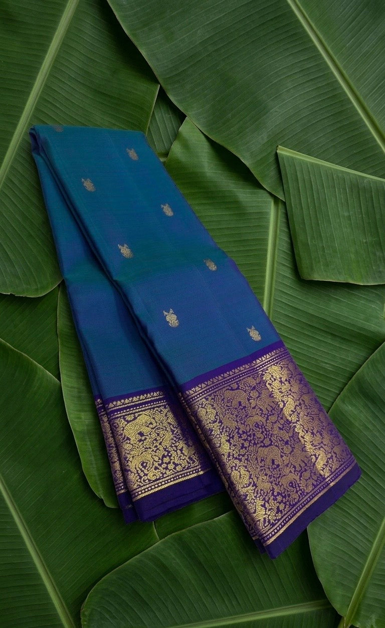 Teal and blue shot colour handwoven Kanchipuram pure silk saree with gandaberunda butta on banana leaf — Idam Living
