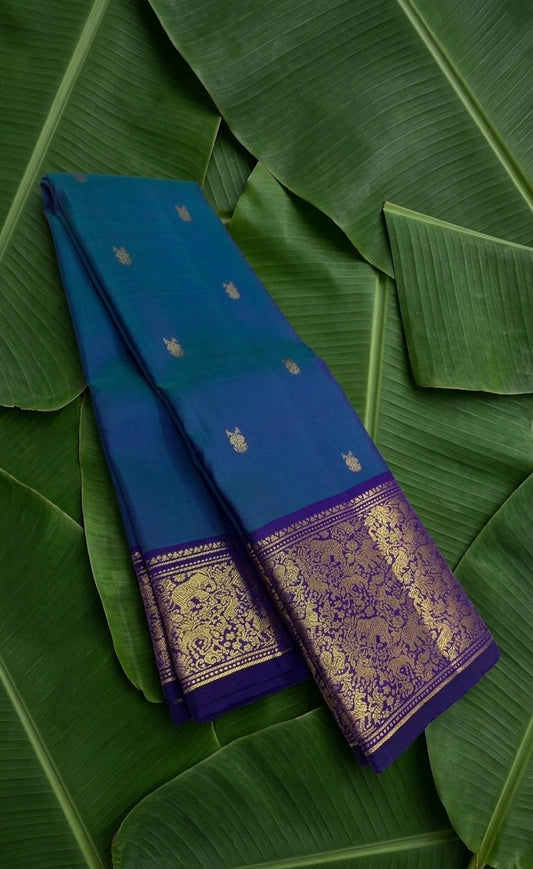 Teal and blue shot colour handwoven Kanchipuram pure silk saree with gandaberunda butta on banana leaf — Idam Living