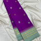 Orchid purple and ice blue Kanjipuram silk saree folded showing Mayil Chakram butta body and contrast ice blue Korvai border