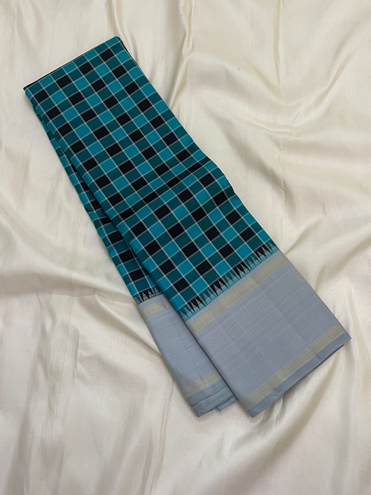 Long-folded teal checked Pure Kanchipuram silk saree showing silver grey border with fine zari woven lines
