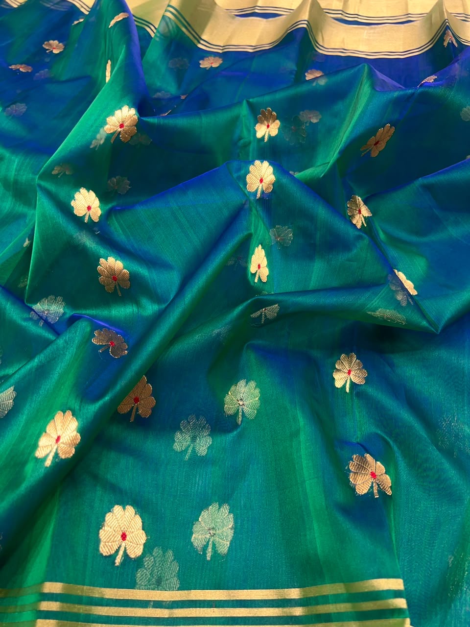 Deeper blue-toned pallu of peacock teal Katan Silk Chanderi saree with fine linear detail