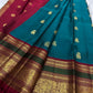 Close view of teal green Kanchipuram silk body with ornate gold zari Yaanai Ambari elephant procession Butta
