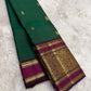 Teal green Kanjeevaram silk saree with traditional gold zari close-up