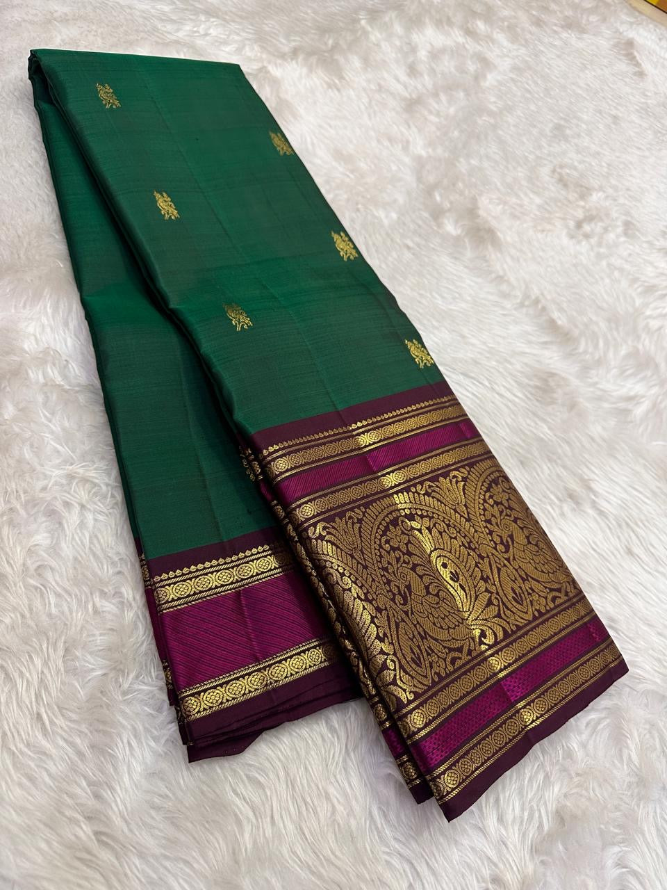 Teal green Kanjeevaram silk saree with traditional gold zari close-up