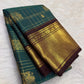 Teal green Pure Silk Kancheepuram Zari Kattam saree with twin Yazhi motifs