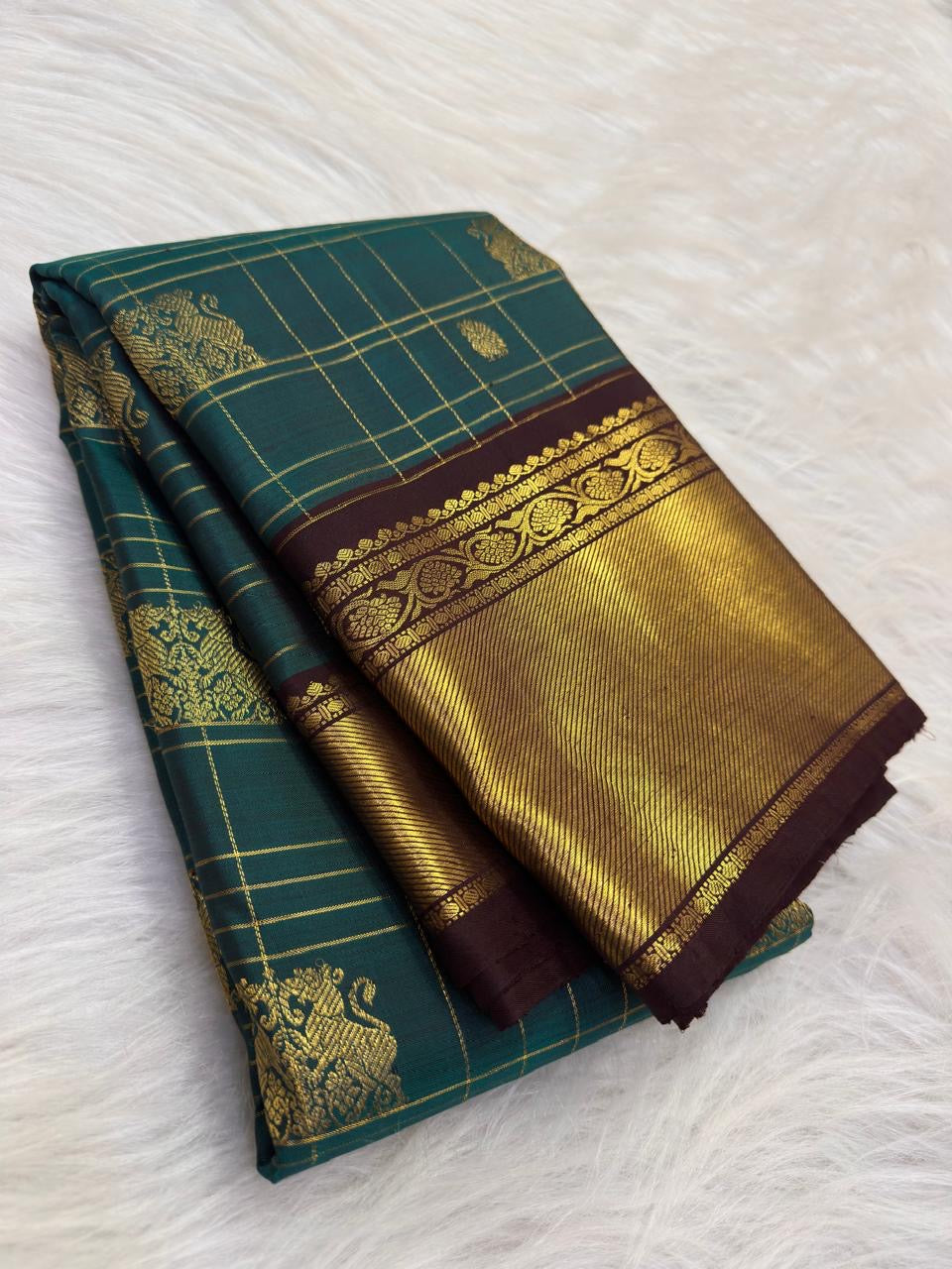 Teal green Pure Silk Kancheepuram Zari Kattam saree with twin Yazhi motifs