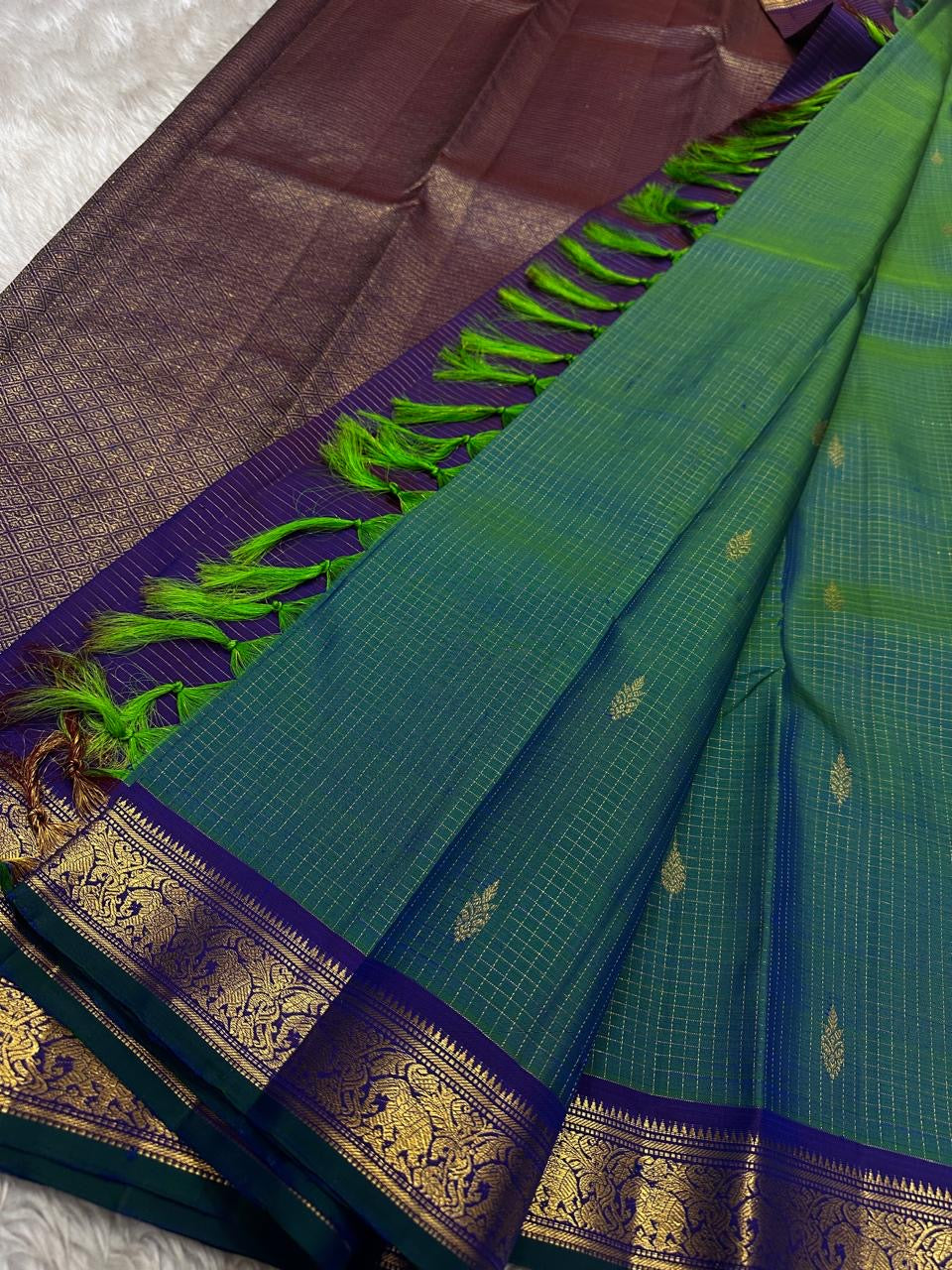 Dense silk Kanjivaram saree with smooth sheen and violet edge