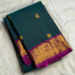 Spaced antique-gold-toned buttas across Deep Teal silk.