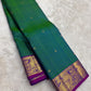 Full view of teal shot colour handwoven Kanchipuram pure silk saree with zari kattam and mayil border — Idam Living