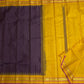 Close view of the temple-inspired zari border where Deep Purple meets Turmeric Yellow silk