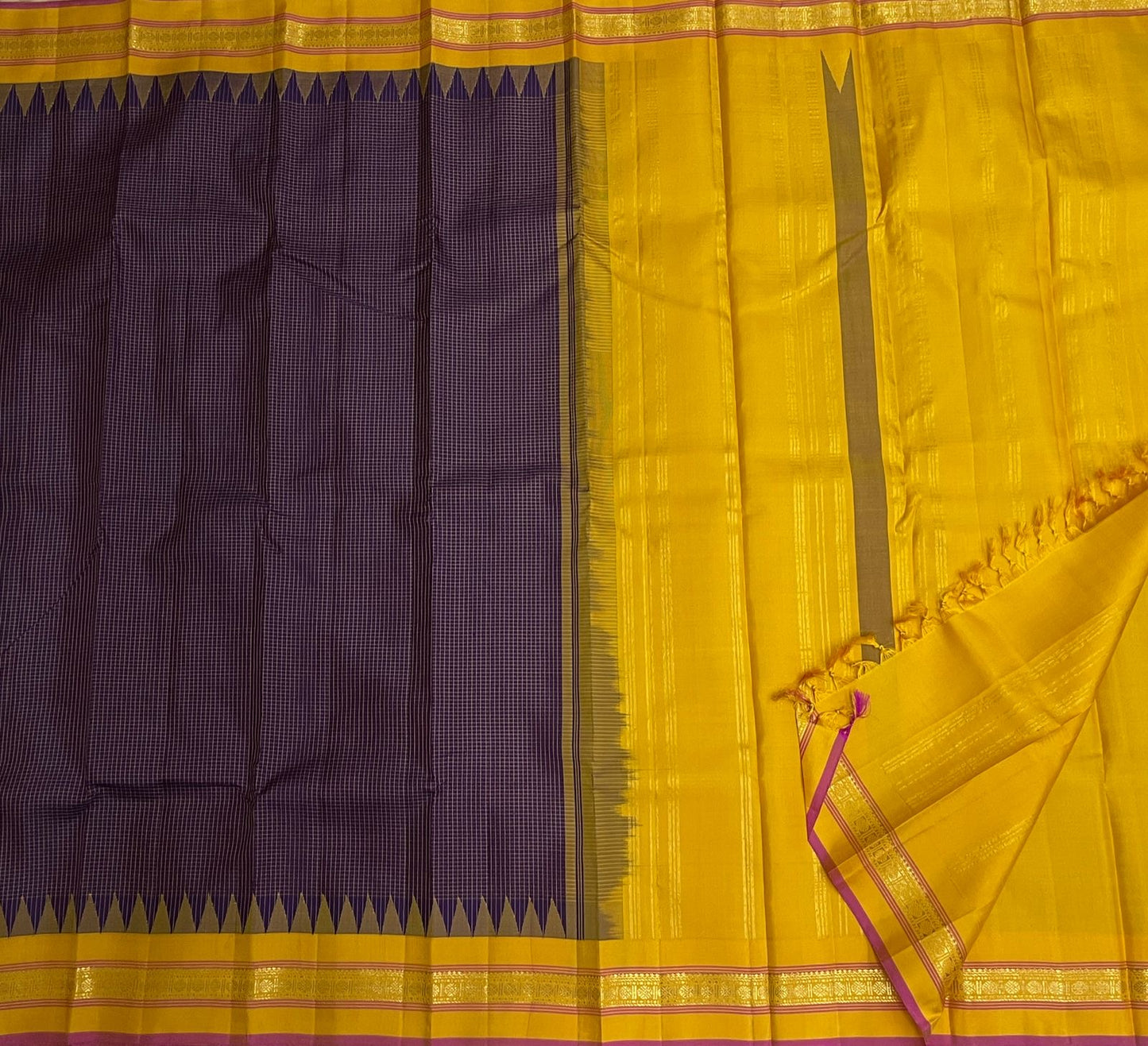 Close view of the temple-inspired zari border where Deep Purple meets Turmeric Yellow silk