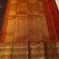 Luxury Kanjivaram silk saree with antique gold zari and ember orange border