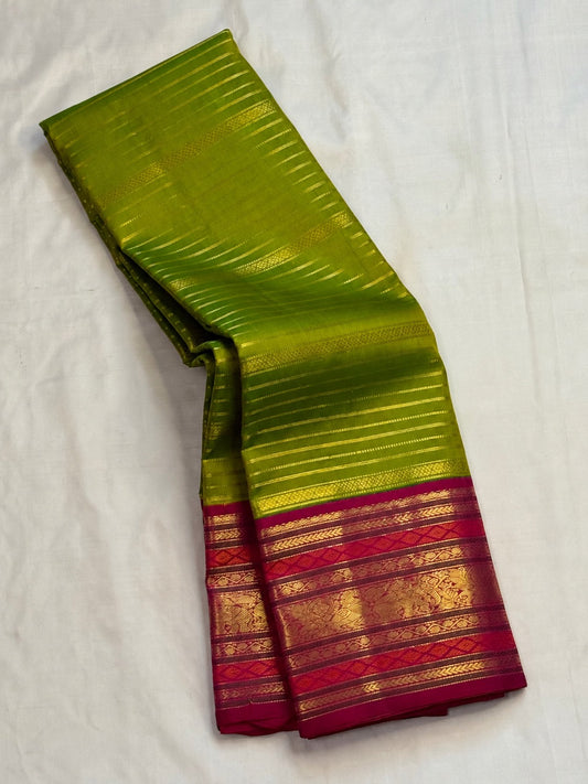Thulir pachai Pure Silk Kanchipuram Vairaoosi saree with luminous zari stripes and pink contrast border.