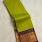 Tender Leaf Green and Navy Purple handwoven pure silk Kanchi Pattu saree with zari Kamalam buttas, full view
