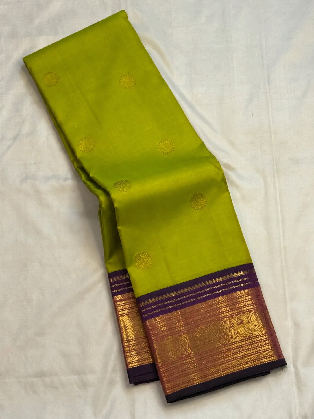 Tender Leaf Green and Navy Purple handwoven pure silk Kanchi Pattu saree with zari Kamalam buttas, full view