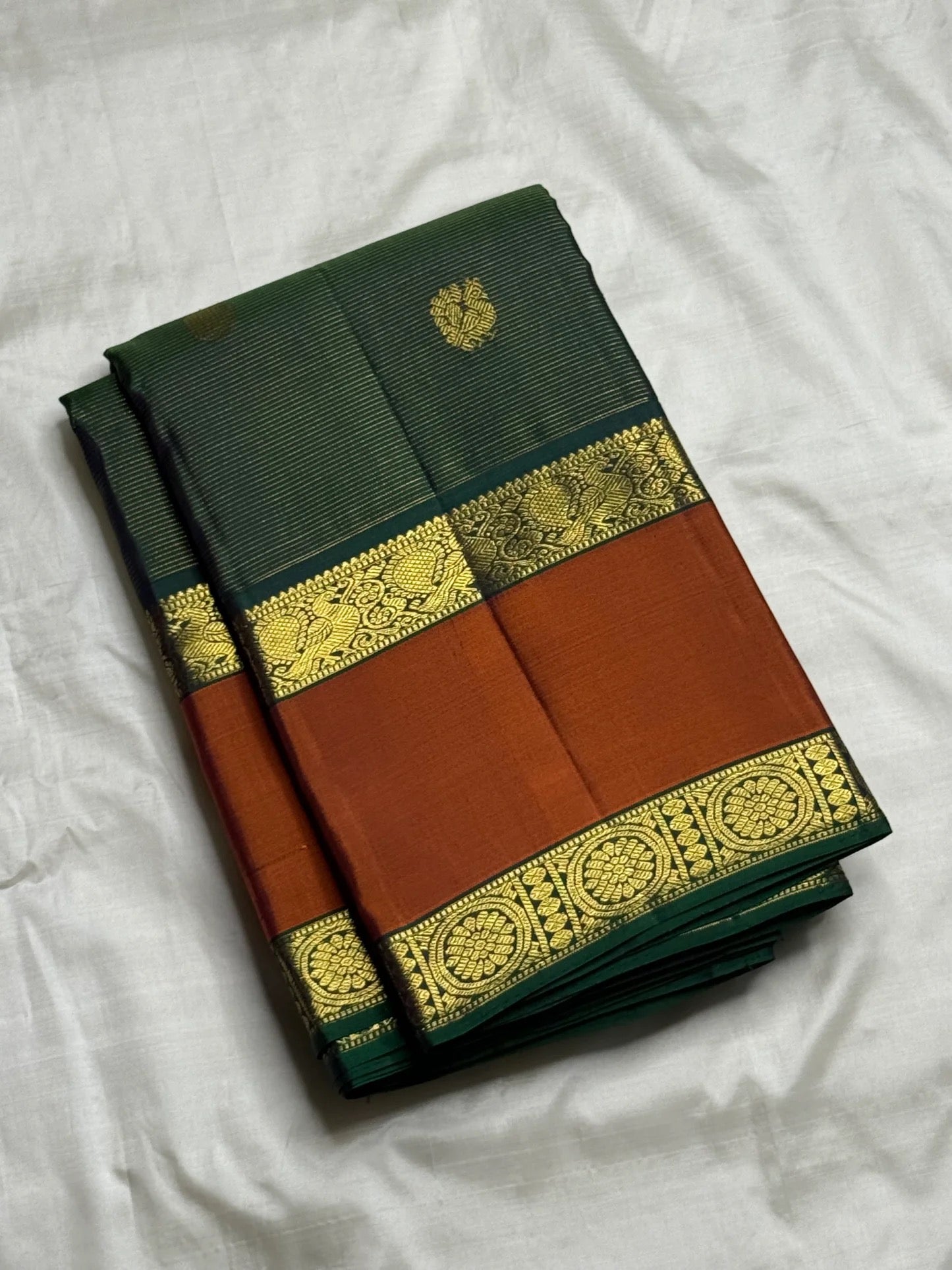 Cinnamon terracotta border with silk thread and gold zari on bottle green vairaoosi saree — Idam Living