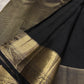 Jet Black Kanjivaram showing large Thazhampoo Reku buttas across the silk body.