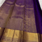 Royal Purple Kanjivaram saree showing traditional Thazhampoo Reku buttas across the silk body.