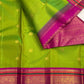 Handwoven Kanchipuram Varisaipet saree in Thulir Pachai Green with Magenta Pink with distinctive traditional silk colouring