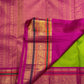 Pure silk Kanchipuram saree in Thulir Pachai Green with Magenta Pink, traditional handwoven border and zari detail