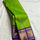 Royal violet zari border on the Thulir Pachai green Kanchipuram Vairaoosi saree