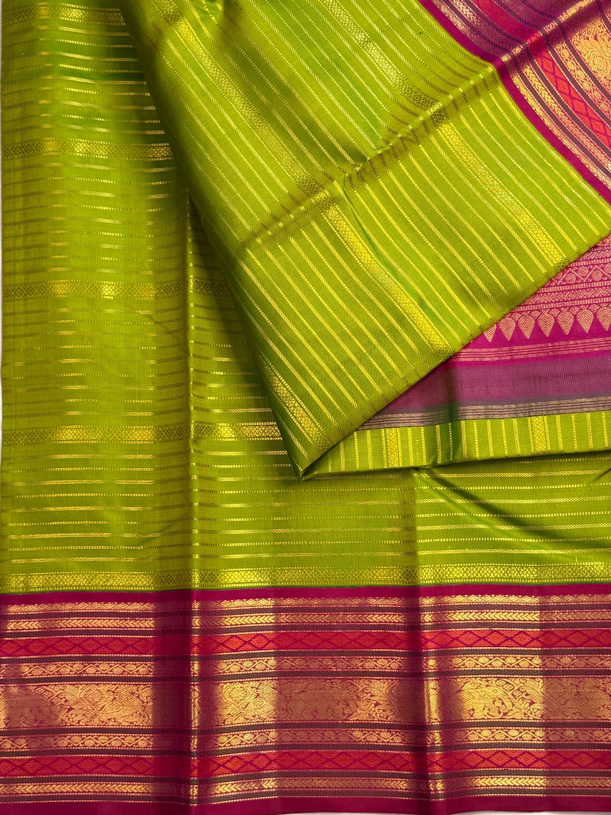 Handwoven thulir pachai green Pure Silk Kanchipuram Vairaoosi saree with jewel-toned pink border.