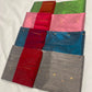 Close-up of gold and silver-toned metallic buttas on the Teal Blue Tissue Silk Chanderi saree.
