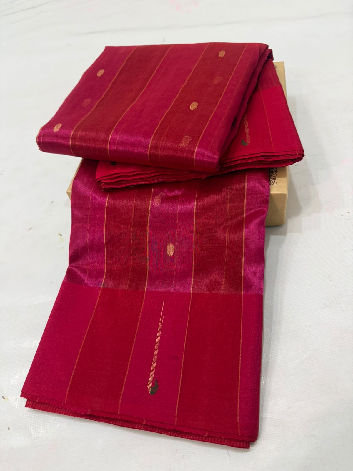 Rani Pink Tissue Silk Chanderi saree draped to show the fine linear jari weaving