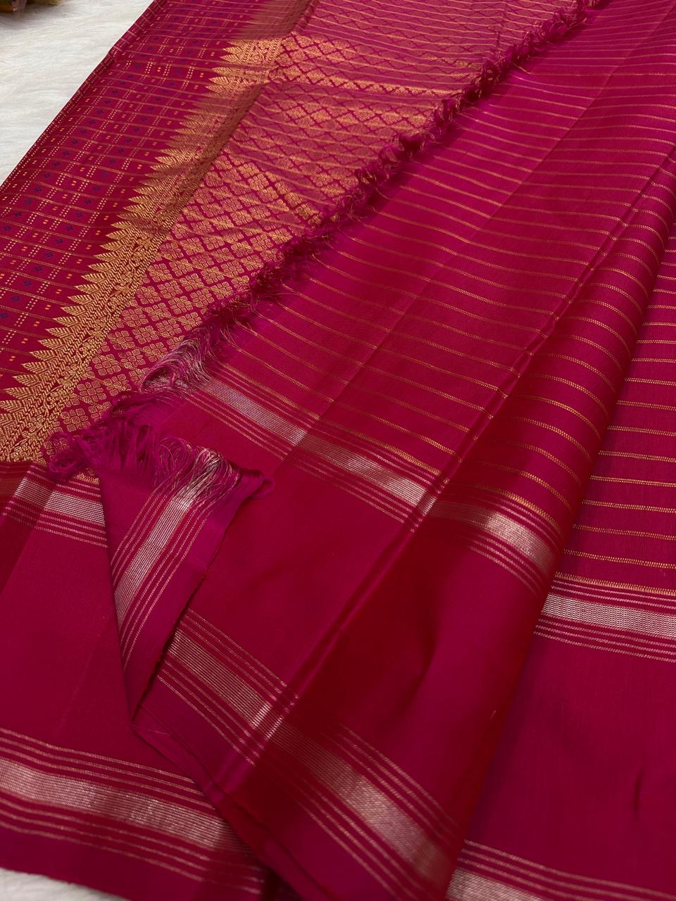 Raspberry pink KanchiPattu saree in pure mulberry silk with the traditional 1000 Butta weave — Idam Living.