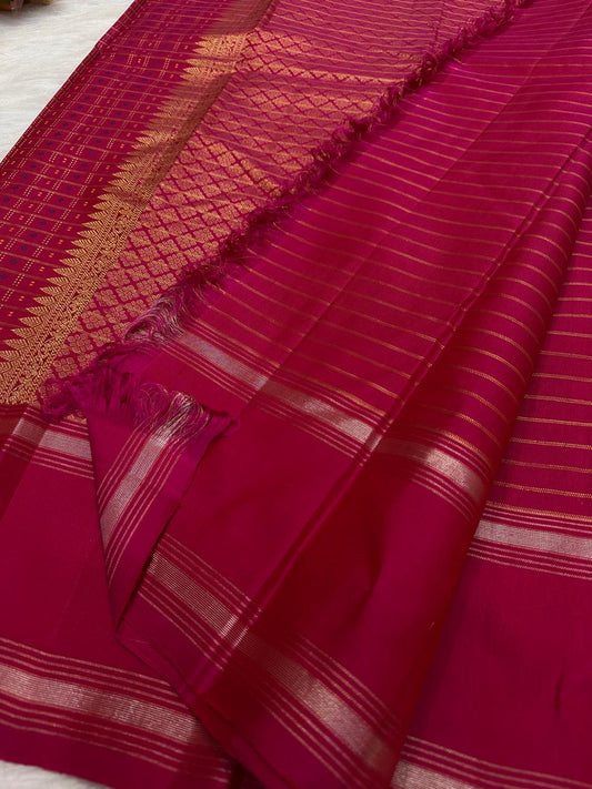 Raspberry pink KanchiPattu saree in pure mulberry silk with the traditional 1000 Butta weave — Idam Living.