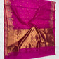 Purplish pink Chanderi Katan silk saree draped to show scattered gold-toned buttas above the wide gold-toned pallu
