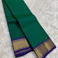 Emerald Green and Neelam Violet-Blue lightweight Kanchipuram silk saree, geometric gold zari border and patterned violet-blue pallu; body detail