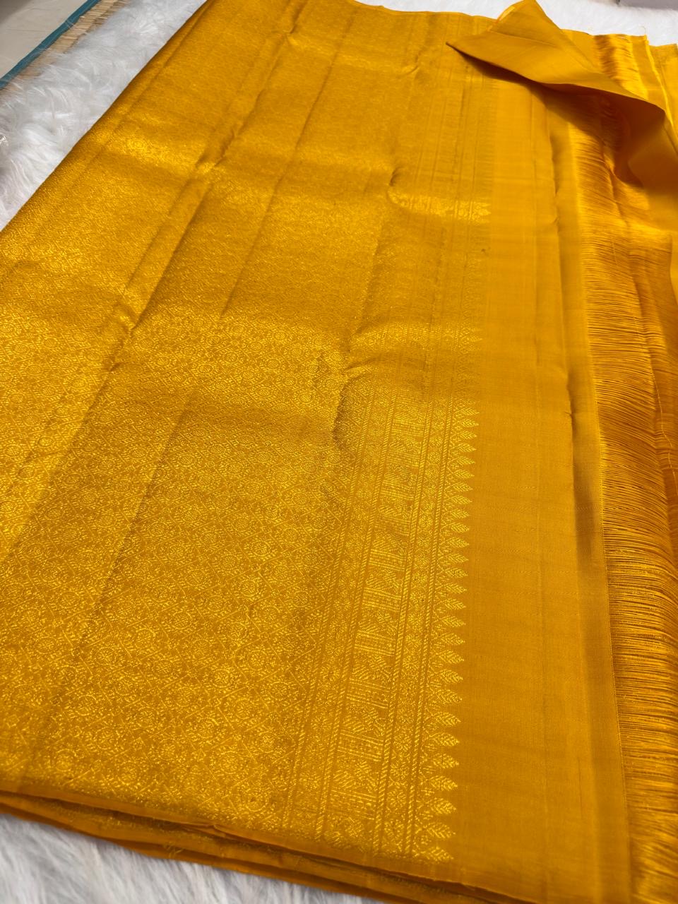 Traditional golden turmeric Kancheepuram silk saree, full drape