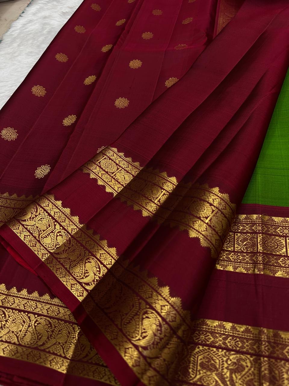 Traditional green Kanchi silk saree with deep ruby rettapet border and gold zari Idam Living