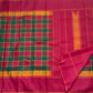 Maragatham green Kanchipuram silk saree, deep green seer pallu with narrow gold-toned lines and zari-edged band