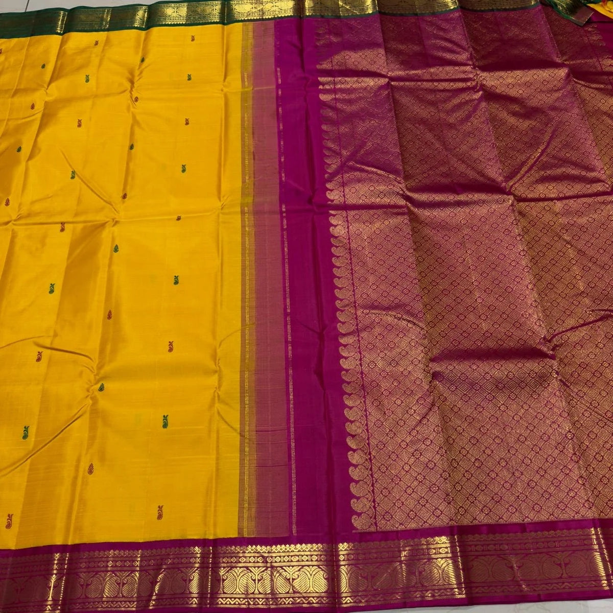 Mustard yellow Ganga-Jamuna Korvai Kanjivaram saree with magenta pallu woven in gold zari diamond lattice