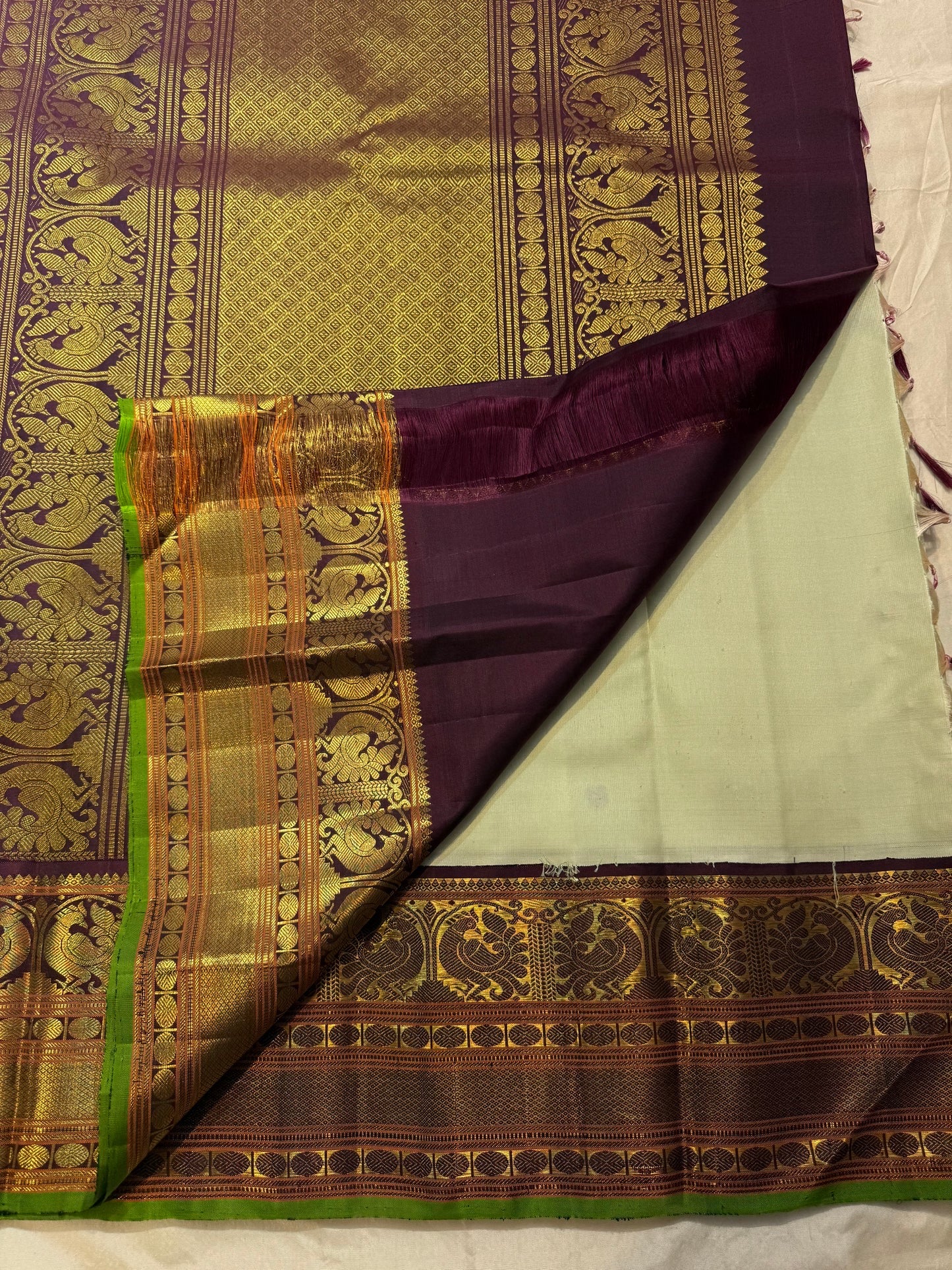 Kanchana style gold zari border panels on pistachio green korvai Kanchipuram silk saree — Idam Living