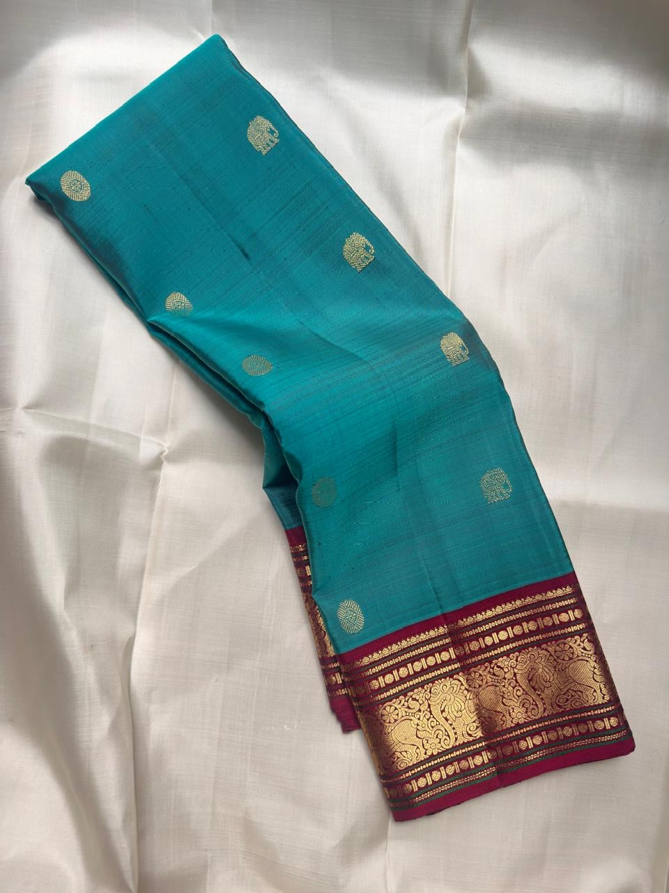Peacock Teal KanchiPattu saree – grand pallu with elephant zari buttas — Idam Living