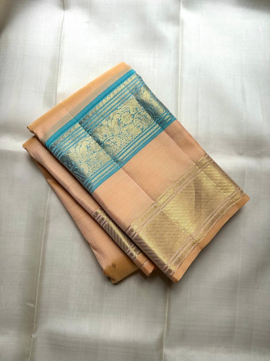 Peacock teal border on champagne peach Kancheepuram pure silk saree