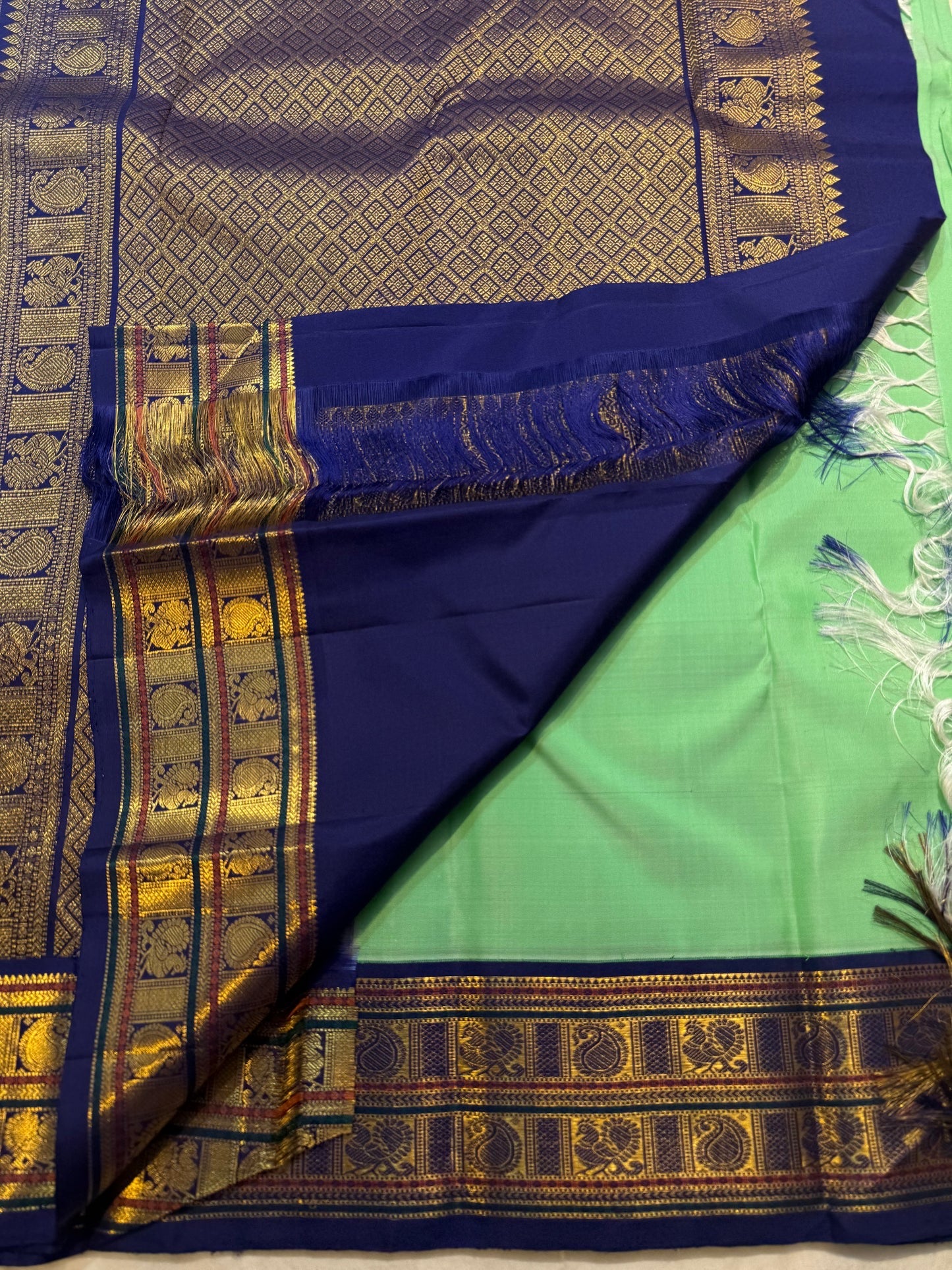 Alternating mayil and maanga butta in gold zari on jade green pure silk Kanchipuram saree — Idam Living