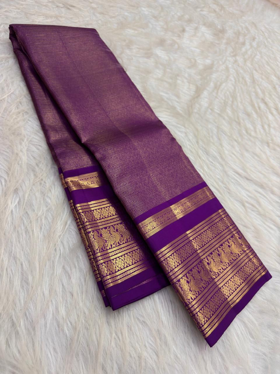 Royal oodha purple and deep aubergine Kanchipuram zari kattam silk sarees, showing body, border and detailed gold zari pallu