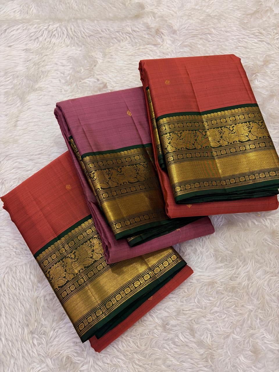 Elegant rust orange Kanjeevaram saree with antique gold woven border